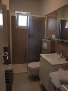 Kúpeľňa v ubytovaní Apartmani Luce + 14 fotografií