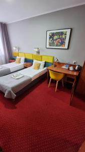Postel nebo postele na pokoji v ubytování Carina Hotel