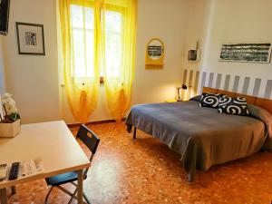 Lo Zizzolo- Bed&Breakfast tesisinde bir odada yatak veya yataklar