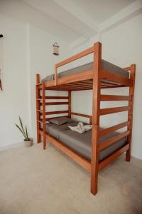 a bunk bed in a room with at Hostal Del Jaguar in Tulum