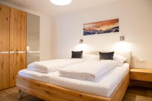 Giường trong phòng chung tại Apart Heimatliebe