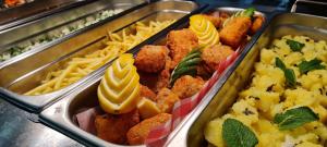 
a tray filled with different types of food at Hotel Crocus in Štrbské Pleso
