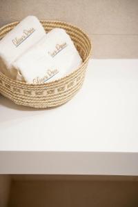 a basket of towels sitting on top of a table at Celine's Rose in Skala Potamias