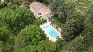 an aerial view of a house with a swimming pool at bastide saint georges in Fayence