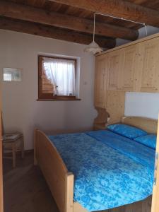 Кровать или кровати в номере Agritur Maso Gosserhof