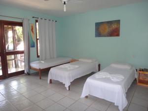 Кровать или кровати в номере Pousada Maresia