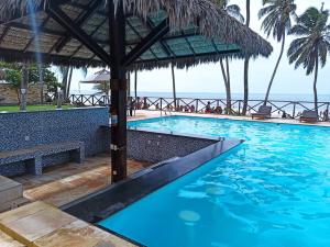 a swimming pool with a view of the ocean at CUMBUCO - Eco Paradise - AP 112 in Caucaia