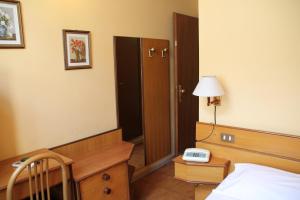 Postel nebo postele na pokoji v ubytování Hotel Vecchia Milano