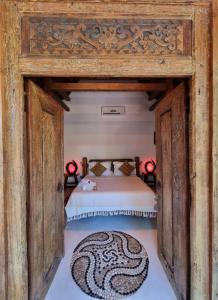 Säng eller sängar i ett rum på Villa Bulan