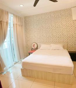 a bedroom with a large white bed and a window at Mansion One Seaview Luxury 2 Bedroom Gurney Georgetown gleneagles in George Town