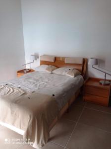 a bedroom with a large bed with two night stands at Condominio con la mejor vista in Cancún
