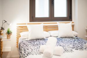 A bed or beds in a room at Plaza Nueva HOMES