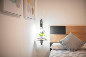 A bed or beds in a room at Plaza Nueva HOMES