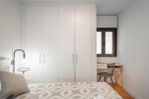 A bed or beds in a room at Plaza Nueva HOMES