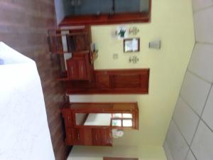 an overhead view of a bathroom with wooden cabinets at Pacific Bay Resort in Boca Chica