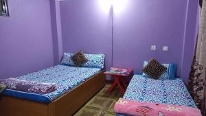 Postel nebo postele na pokoji v ubytování City View Home Stay