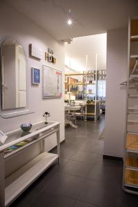 a bathroom with a sink and a mirror at Happy Home Bo Centro FREE PRIVATE PARKING in Bologna