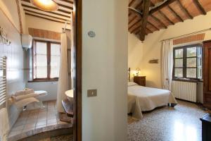 Łóżko lub łóżka w pokoju w obiekcie Agriturismo Poggio Salvi