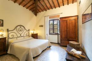 Łóżko lub łóżka w pokoju w obiekcie Agriturismo Poggio Salvi