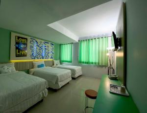 Voodi või voodid majutusasutuse Transformer Center Hotel toas
