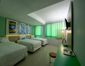 Postel nebo postele na pokoji v ubytování Transformer Center Hotel