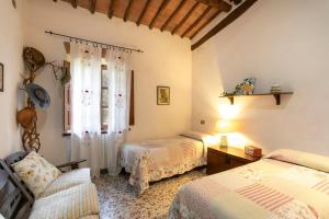 Łóżko lub łóżka w pokoju w obiekcie Agriturismo Poggio Salvi