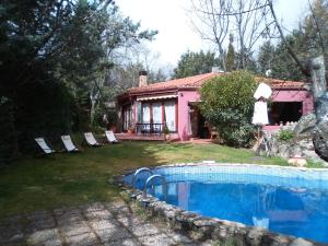 a house with a swimming pool in the yard at Casa Rural Saint Joseph in Peralejo