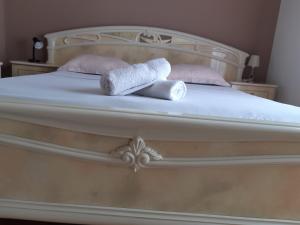 a bed with two towels on top of it at antonio in Bibinje