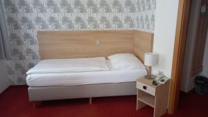 Postel nebo postele na pokoji v ubytování Hotel Flora