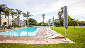 The swimming pool at or close to Modern self-catering apartment in a secure estate