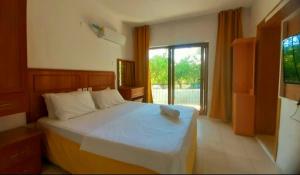 Postel nebo postele na pokoji v ubytování Sunset Boutique Hotel & Apartments