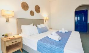 A bed or beds in a room at Veneto Sea View Apartments