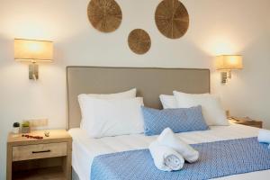 A bed or beds in a room at Veneto Sea View Apartments