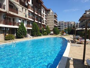 a large swimming pool in front of a building at MitProt Panorama Bay 2 ap 31 in Sveti Vlas