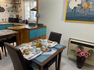 a table with food on it in a kitchen at B&B Mare Monti Miniere in Iglesias