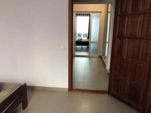 an empty room with a door and a hallway at Hotel Golden Beach in Zatoka