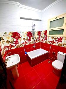 a bathroom with a white sink and a toilet at شقة بأطلالة علي الشاطئ in Alexandria