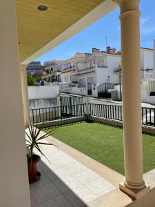 a view from the balcony of a apartment at Zulla Moradia T3, Praia do Norte in Nazaré