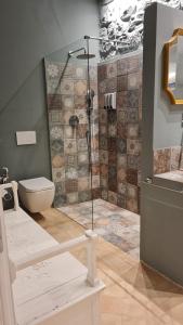 a bathroom with a shower and a toilet in it at medium miramare appartamento sogno sul mare in Trieste