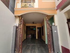 an entrance to a building with a hallway at JK Royal Palace And Lodge in Allahābād