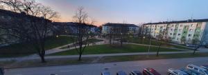 a view of a street with parked cars in a city at Big Petera in Ventspils