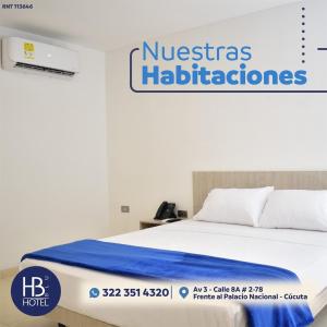 A bed or beds in a room at Hotel Blu Cúcuta