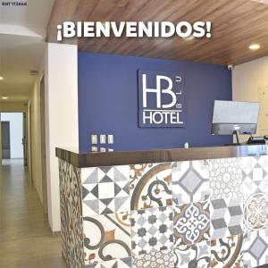 a sign for a hdb hotel in a lobby at Hotel Blu Cúcuta in Cúcuta