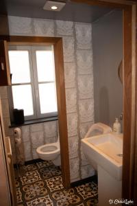 a bathroom with a toilet and a sink at Halte St. Christophe in Ypres