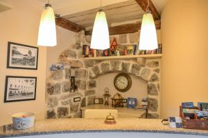 a living room with a clock on the wall at Villa Perla Di Mare in Budva