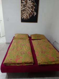 a bed sitting against a wall in a room at Lahor in Bihać
