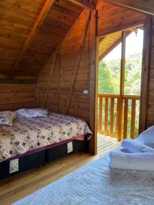 Ein Bett oder Betten in einem Zimmer der Unterkunft chalés Sítio Anjo Gabriel