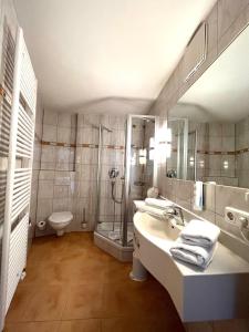 Ванная комната в Hotel Fischer am See