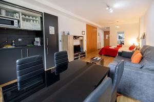a living room with a couch and a dining room at Studio at Arinsal 100 m away from the slopes with wifi in Arinsal