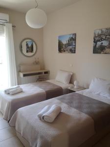 A bed or beds in a room at Casa Plumeria at Gouves Beach